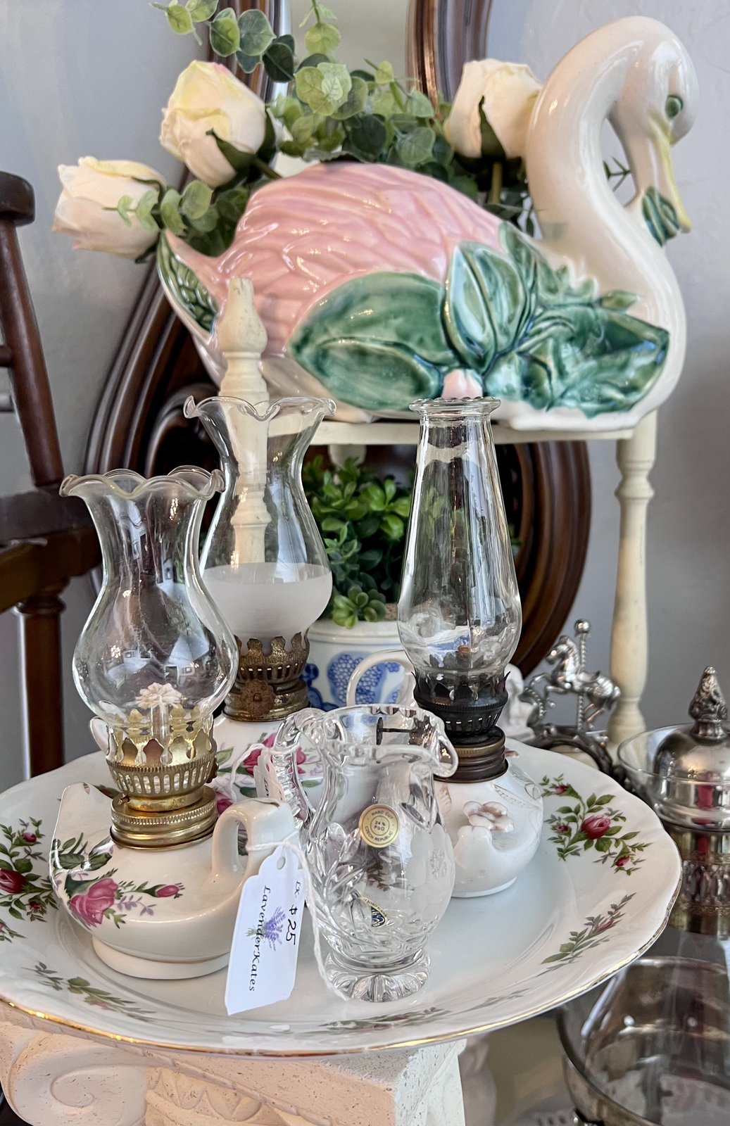 Glass hurricane shades and a swan dish