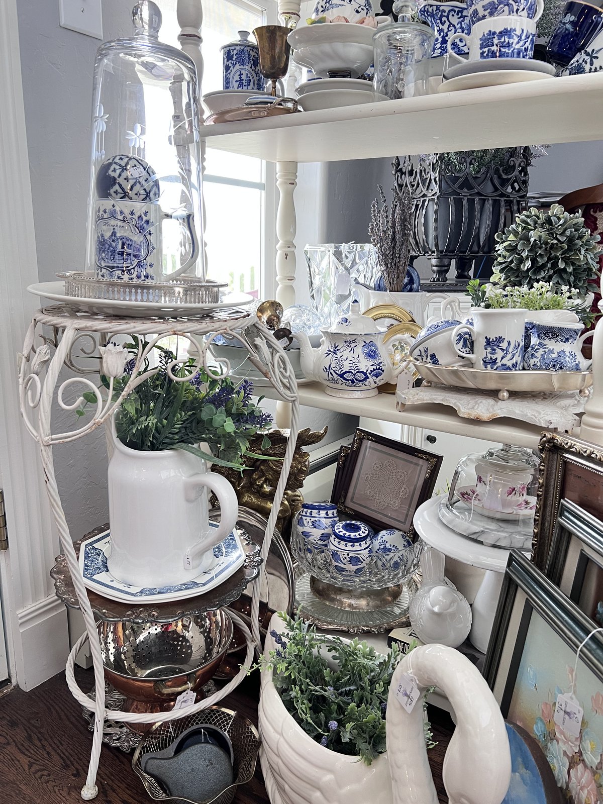 A curated shelf of vintage china