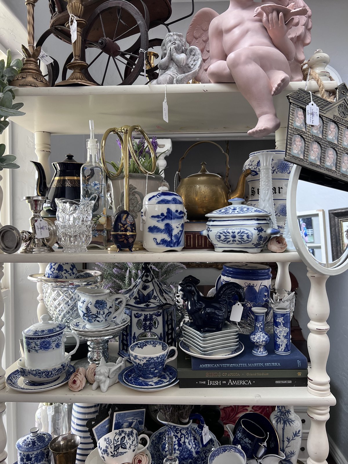 A curated corner of vintage tapestries and mirrors