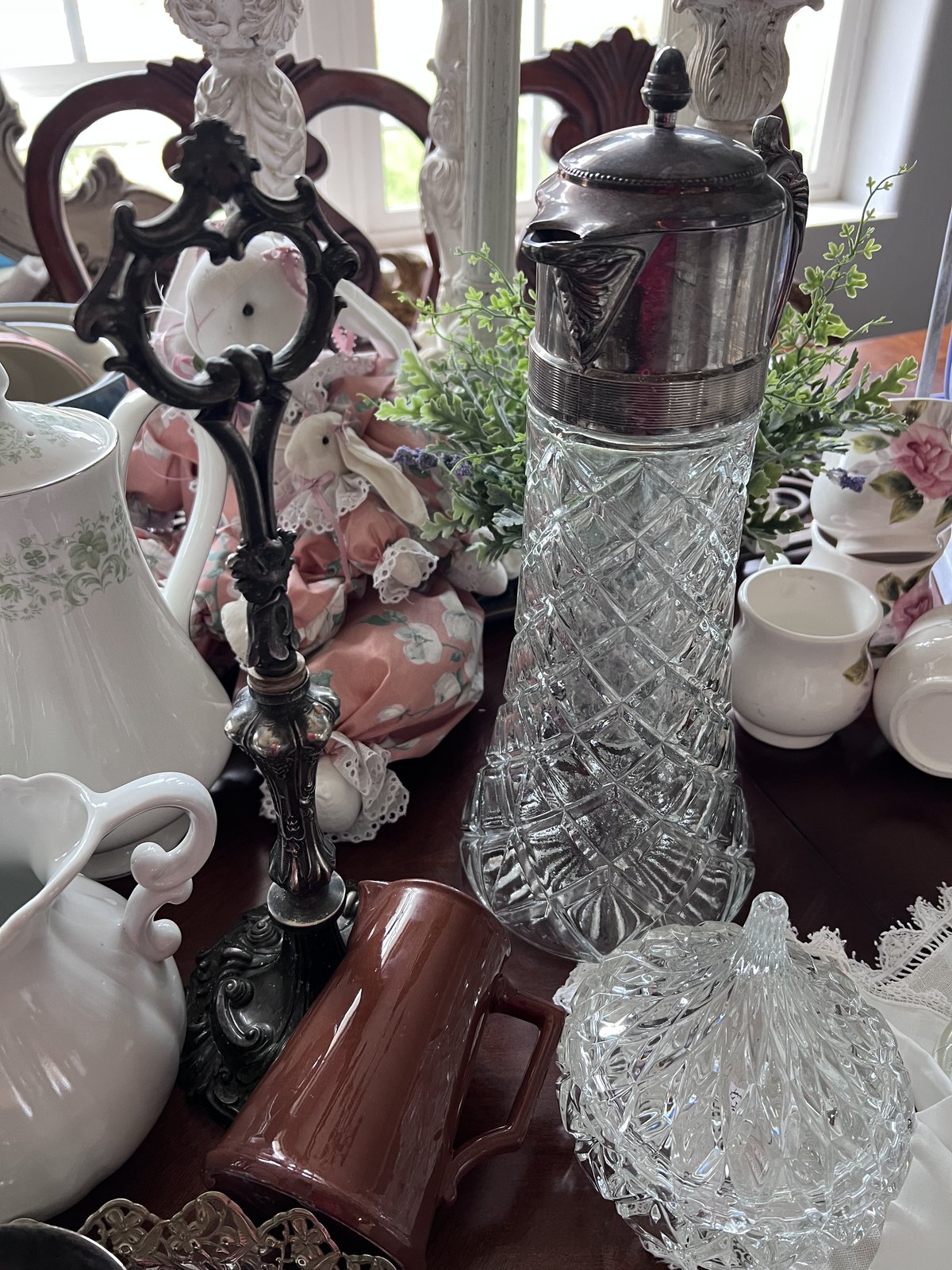 Cut crystal claret jug with a silver lid