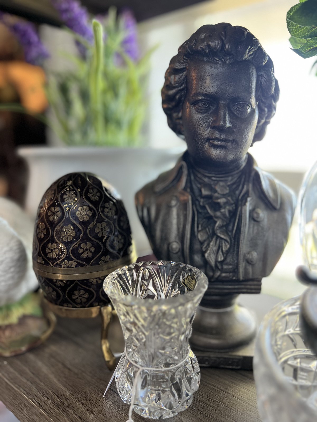 Bronze cherub bust with a jeweled egg box and cut crystal vase