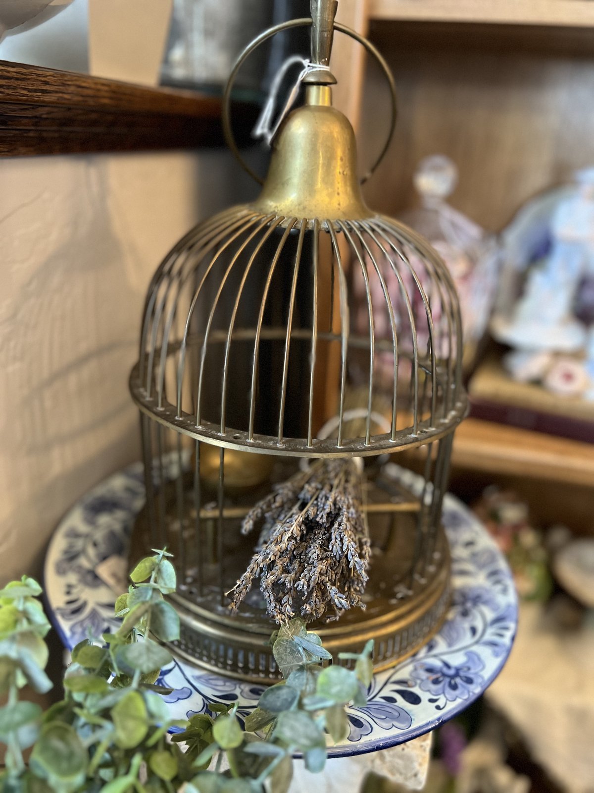 Brass birdcage lantern filled with dried lavender
