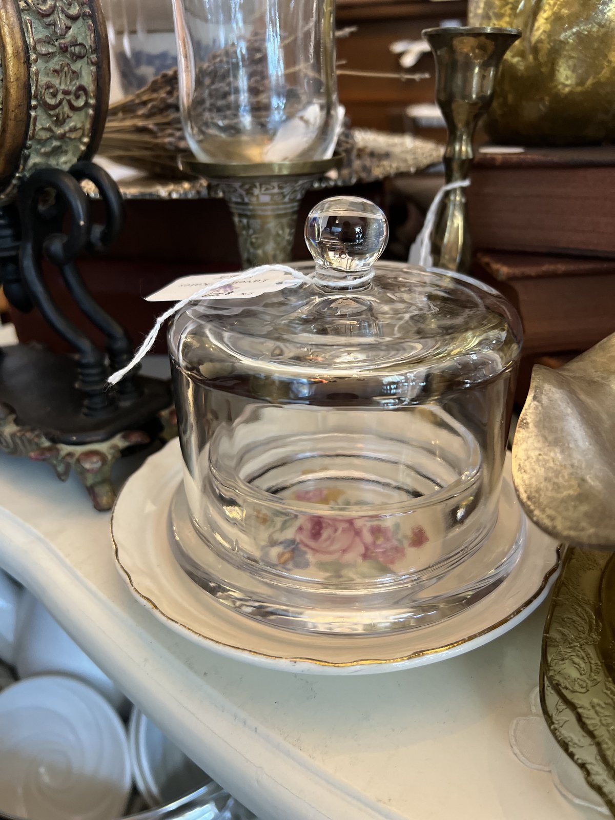 Glass cheese dome over a hand-painted rose porcelain base